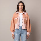 Women's cropped utility jacket with long sleeves, chest pockets and frayed trims