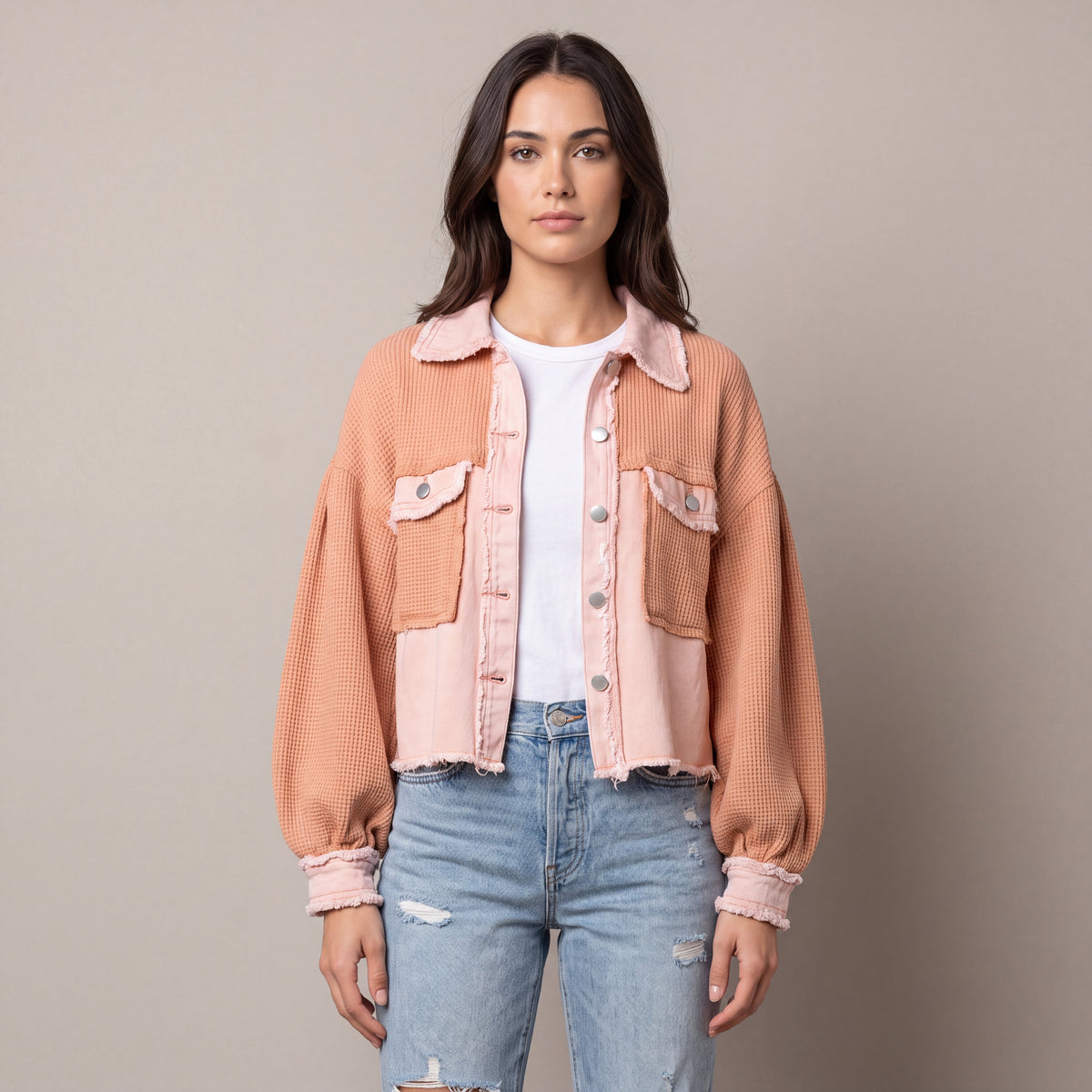 Women's cropped utility jacket with long sleeves, chest pockets and frayed trims