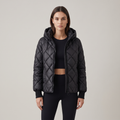 Women's oversized quilted hooded puffer jacket with long sleeves and zip front