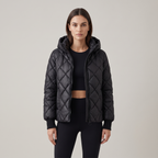 Women's oversized quilted hooded puffer jacket with long sleeves and zip front