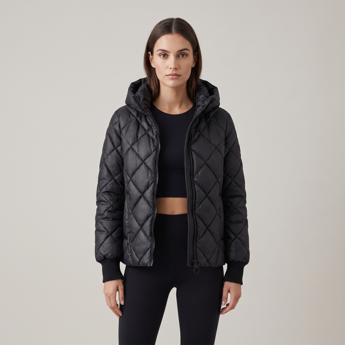 Women's oversized quilted hooded puffer jacket with long sleeves and zip front