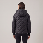 Women's oversized quilted hooded puffer jacket with long sleeves and zip front