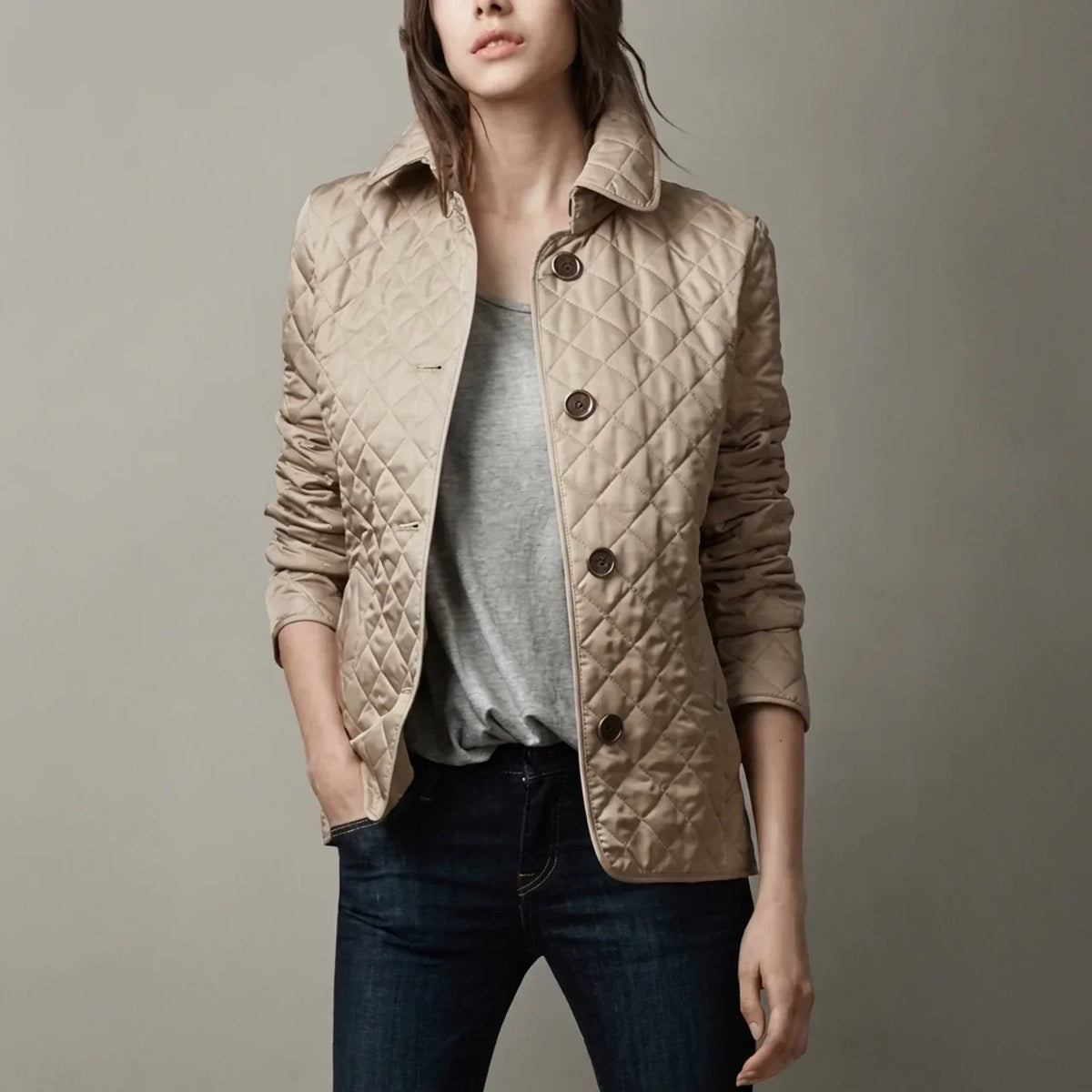 Women's diamond quilted jacket with stand collar and button front