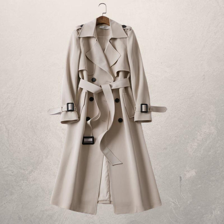 Women's double-breasted belted trench coat with long sleeves and buckle details