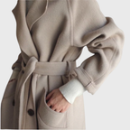 Women's longline overcoat with notched lapels and double-button front