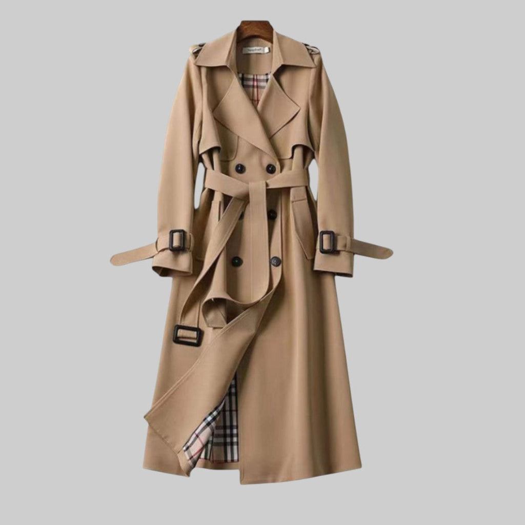 Women's double-breasted belted trench coat with long sleeves and buckle details