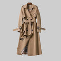 Women's double-breasted belted trench coat with long sleeves and buckle details
