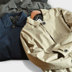Men's button-front coat with point collar, long sleeves and side pockets
