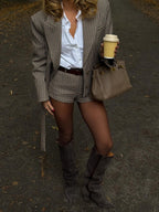 Women's brown checked blazer with notched lapels, long sleeves and button fastening