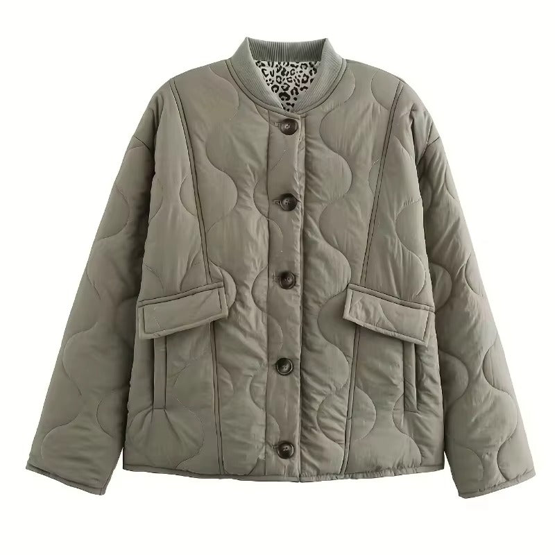 Women's quilted jacket with leopard-print cuffs, button front and flap pockets