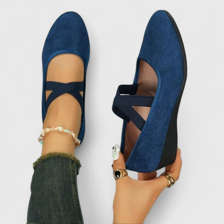 Women's strappy wedge shoes with Mary Jane-inspired cross straps and almond toe