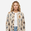 Women's beige cardigan with an all-over cat pattern and button front