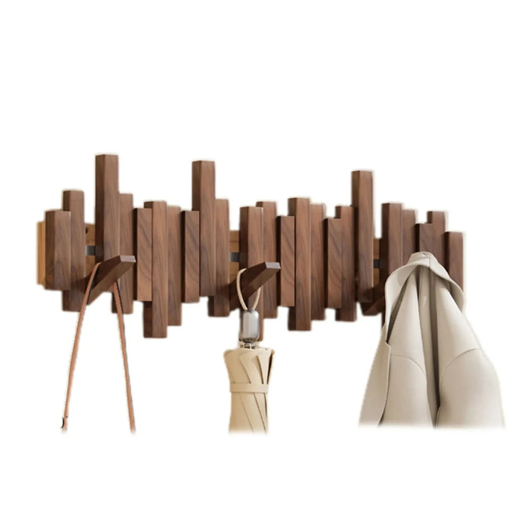 Wall-mounted slatted wooden coat rack with multiple hooks, umbrella and coat