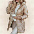 Women's longline hooded quilted winter jacket with zip front and ribbed cuffs