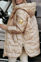 Women's longline hooded quilted winter jacket with zip front and ribbed cuffs