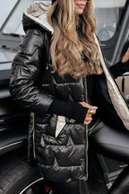 Women's longline hooded quilted winter jacket with zip front and ribbed cuffs