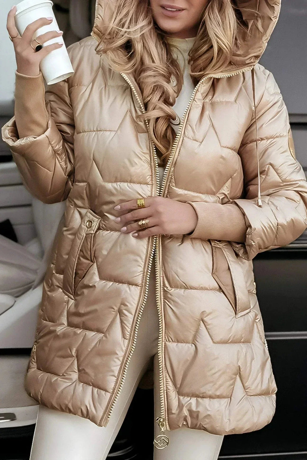 Women's longline hooded quilted winter jacket with zip front and ribbed cuffs