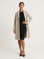Women's long straight coat with notched lapel and side pockets