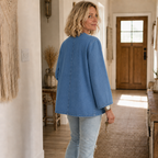 Women's collarless button-down cardigan with long sleeves and front pockets