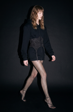 Women's black zip-up hoodie with hood, long sleeves and silver-studded corset-style front panel