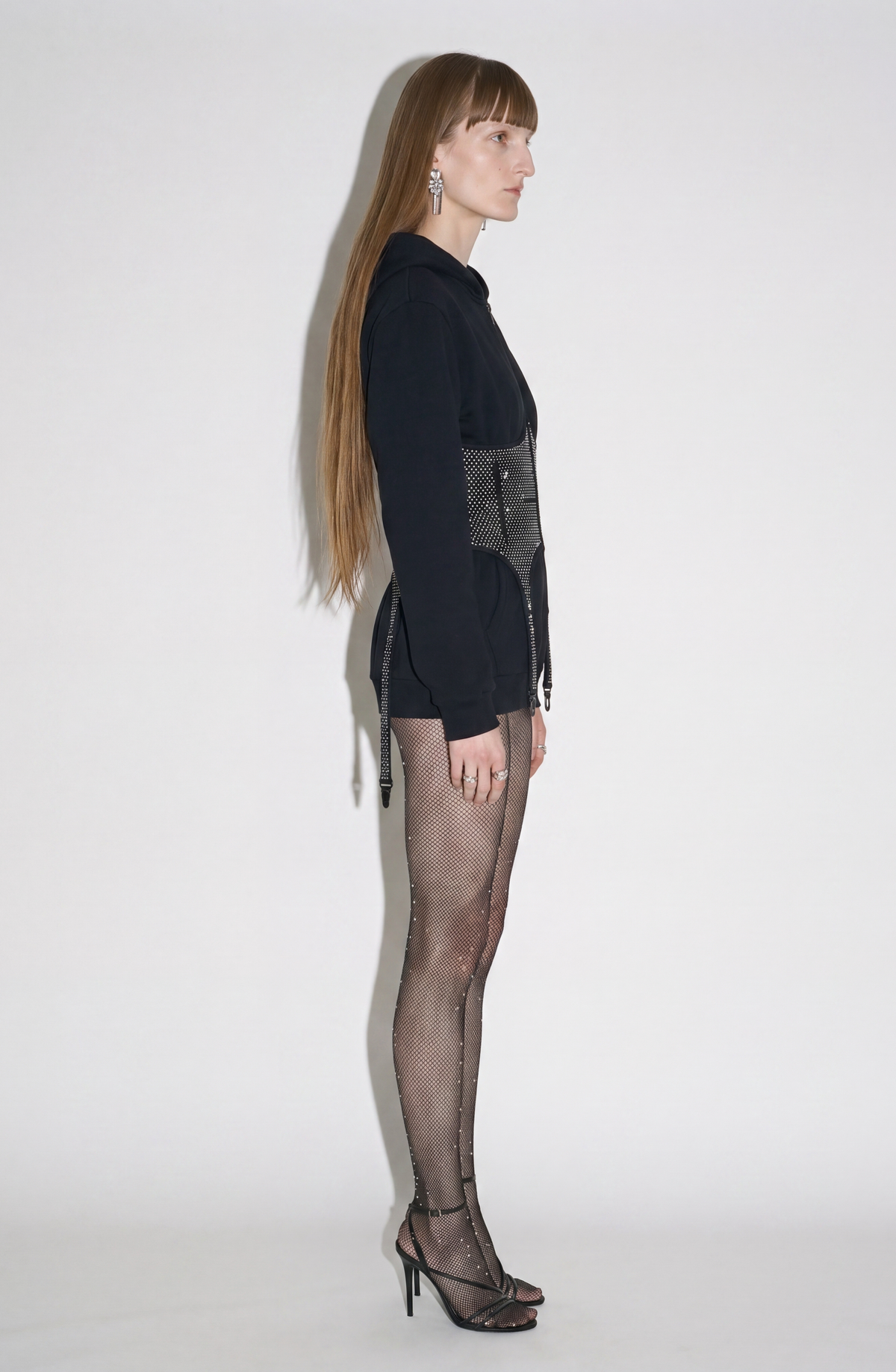 Women's black zip-up hoodie with hood, long sleeves and silver-studded corset-style front panel