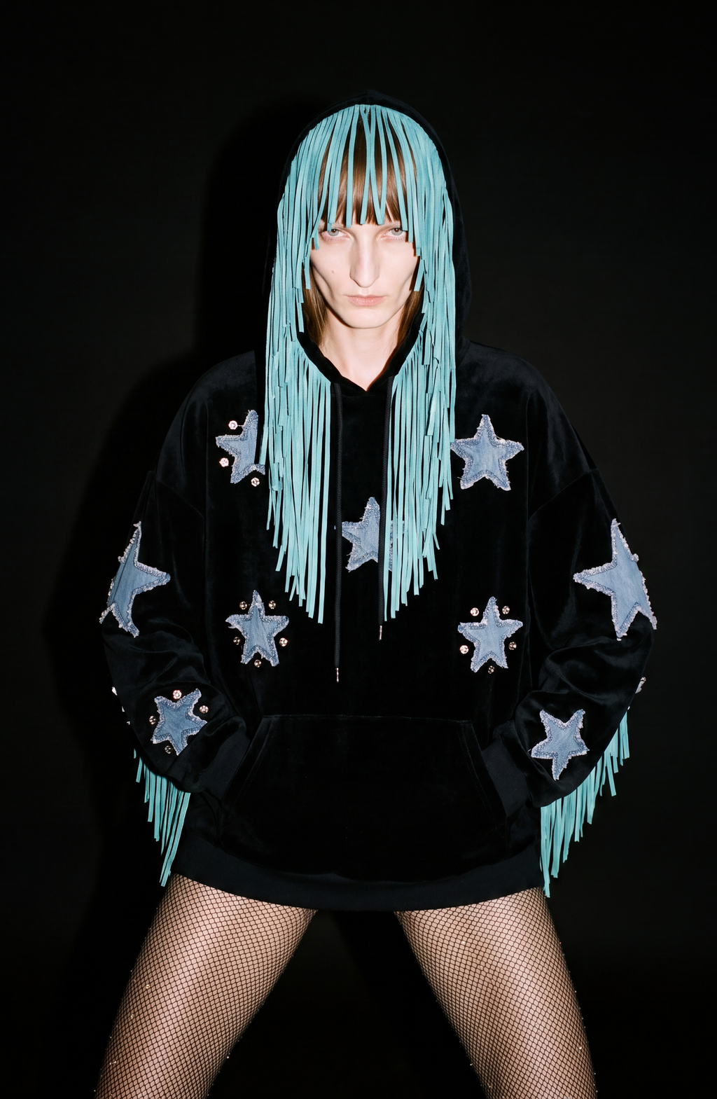 Black hooded hoodie with blue star appliques and turquoise fringe trim