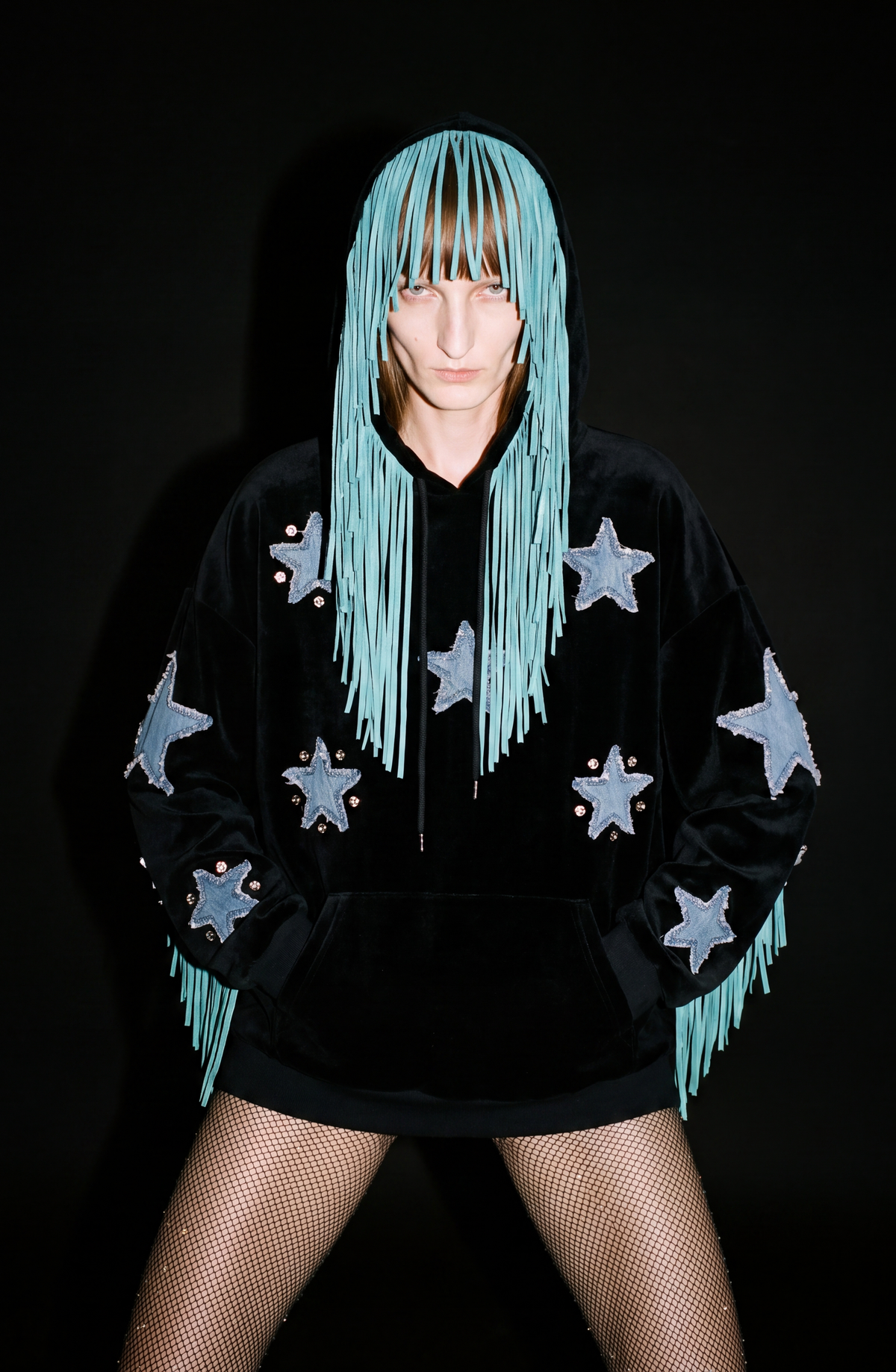Black hooded hoodie with blue star appliques and turquoise fringe trim