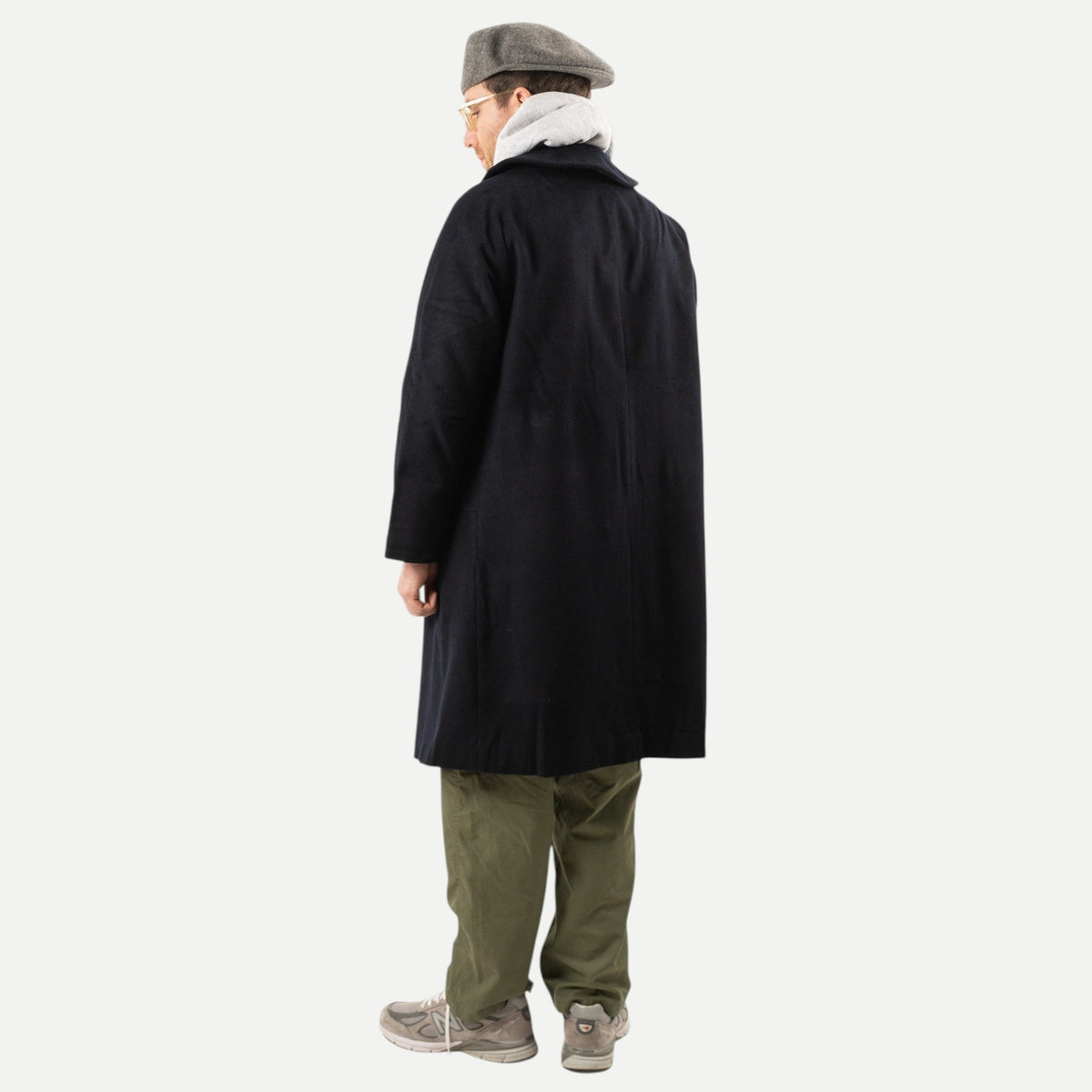 Men's navy overcoat with long sleeves, notched collar and button front