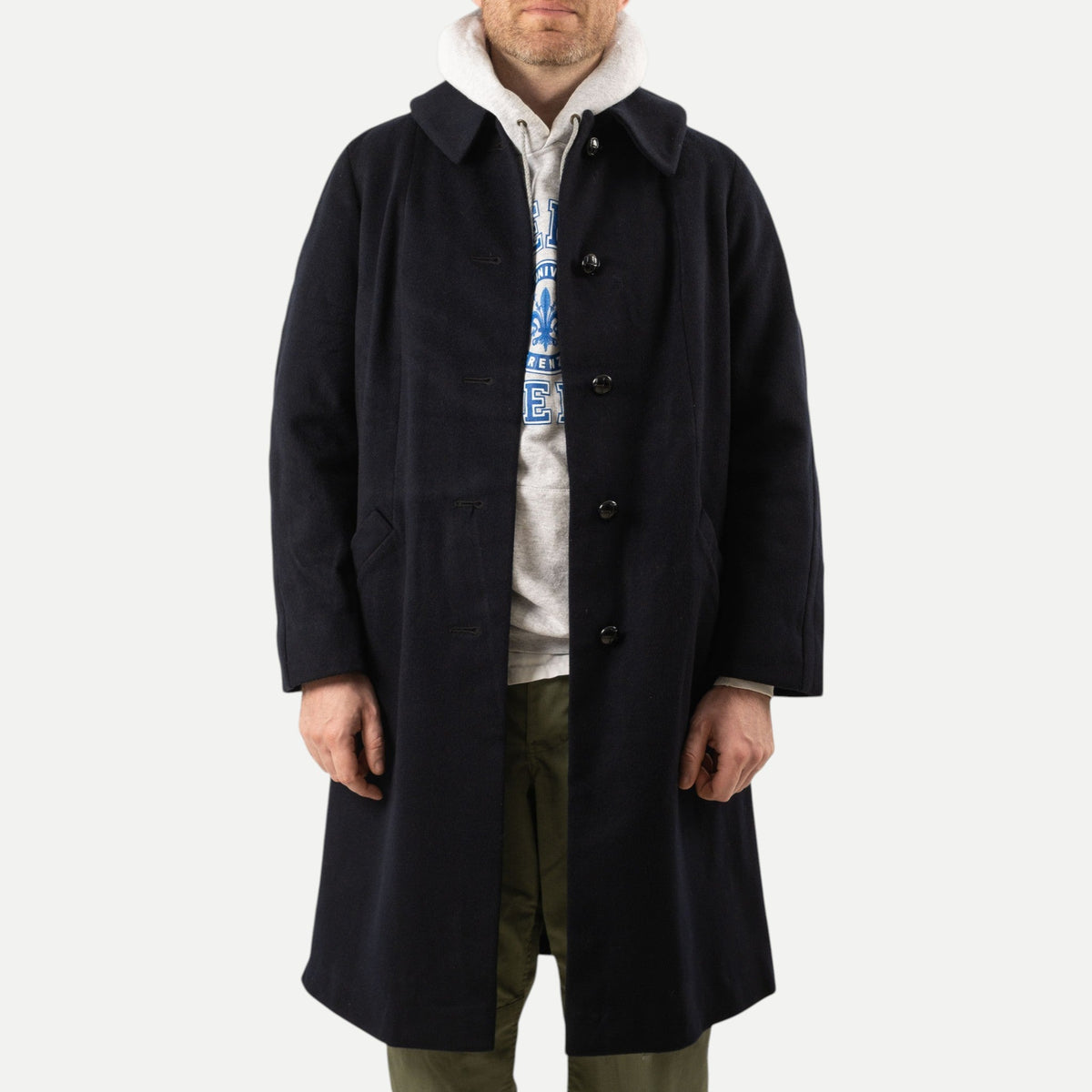 Men's navy overcoat with long sleeves, notched collar and button front