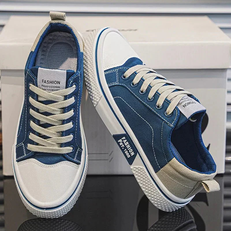 Low-top lace-up trainers shown in blue and green colourways with round toes and contrast soles