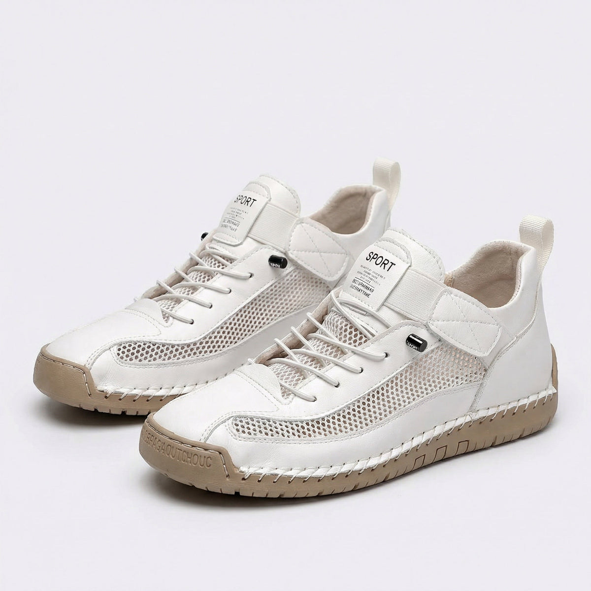 Women's lace-up trainers with mesh side panels, rounded toe and flat textured sole