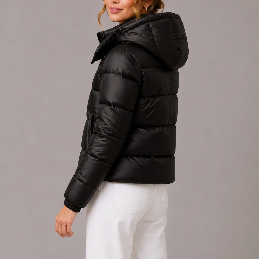 Women's quilted hooded puffer jacket shown in navy and black with long sleeves and front pockets