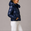 Women's quilted hooded puffer jacket shown in navy and black with long sleeves and front pockets