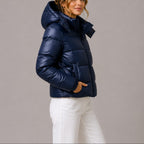 Women's quilted hooded puffer jacket shown in navy and black with long sleeves and front pockets