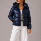 Women's quilted hooded puffer jacket shown in navy and black with long sleeves and front pockets