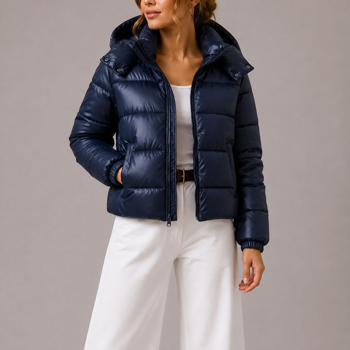 Women's quilted hooded puffer jacket shown in navy and black with long sleeves and front pockets