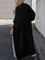 Women's long textured open front cardigan with balloon sleeves and front pockets