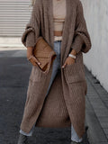 Women's long textured open front cardigan with balloon sleeves and front pockets