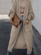 Women's long textured open front cardigan with balloon sleeves and front pockets