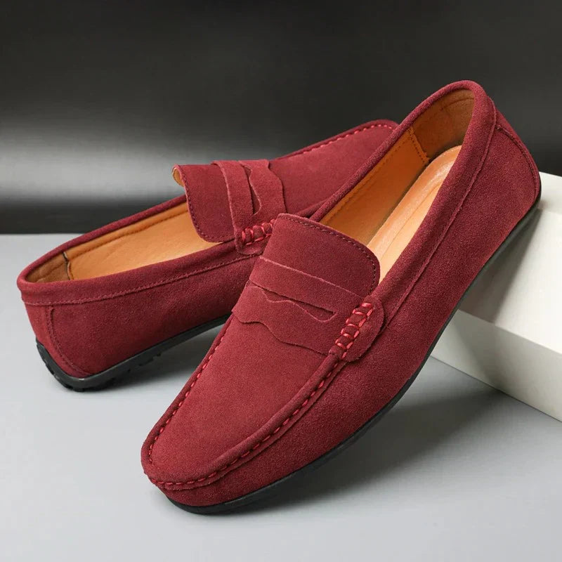 Men's slip-on loafers with moc toes, penny straps and stitched edging in navy and red colourways