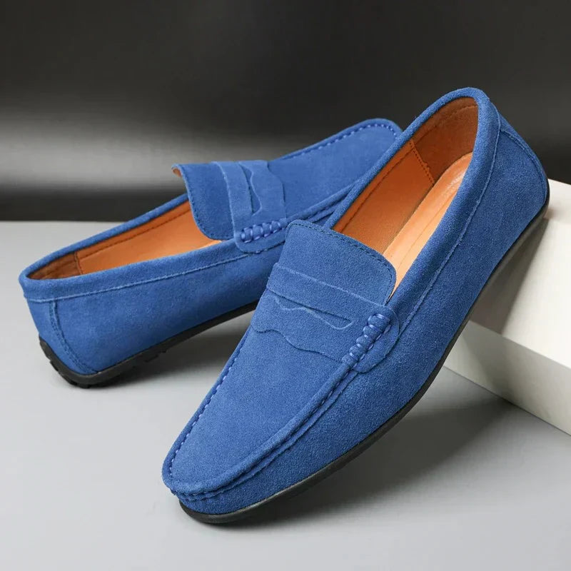 Men's slip-on loafers with moc toes, penny straps and stitched edging in navy and red colourways