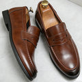 Men's penny loafers with a vamp band, almond toe and low heel