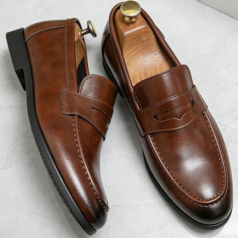 Men's penny loafers with a vamp band, almond toe and low heel