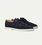 Men's lace-up moccasin shoes with rounded stitched toe and flat light sole