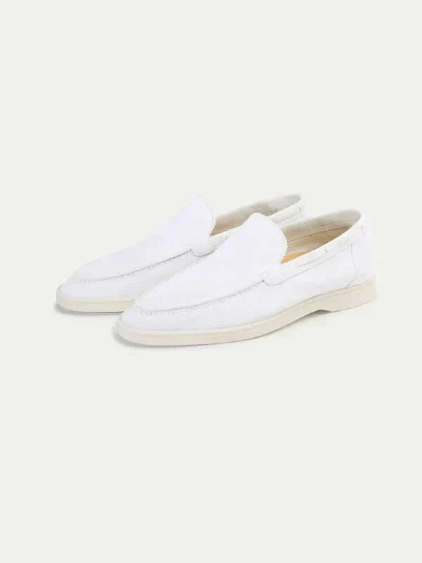 Men's white slip-on loafers with moc toe stitching and flat soles