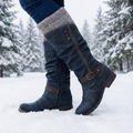 Women's tall slouch boots with side zips and buckle straps in snow