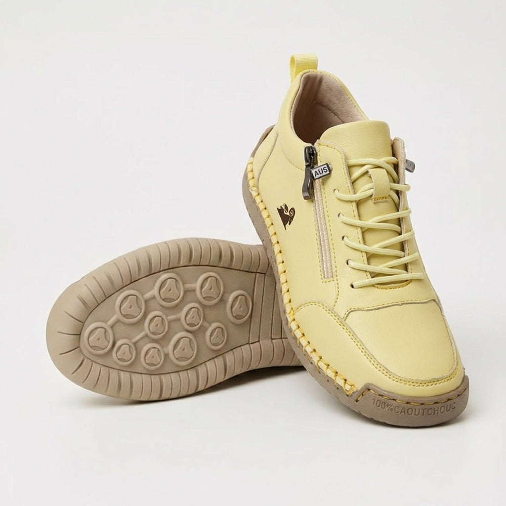 Women's low-top zip sneakers with lace-up fronts, round toes and flat textured soles