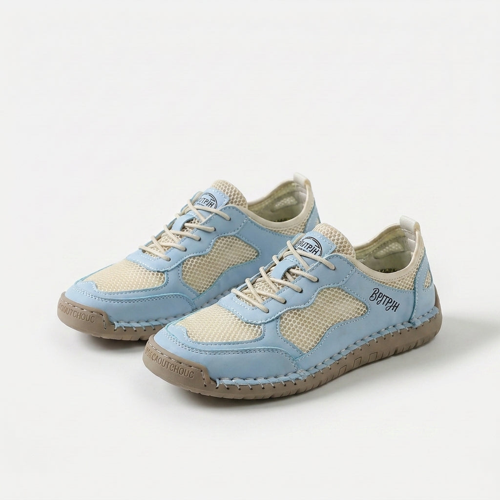 Low-profile lace-up sneakers with mesh panels and contrast stitched overlays