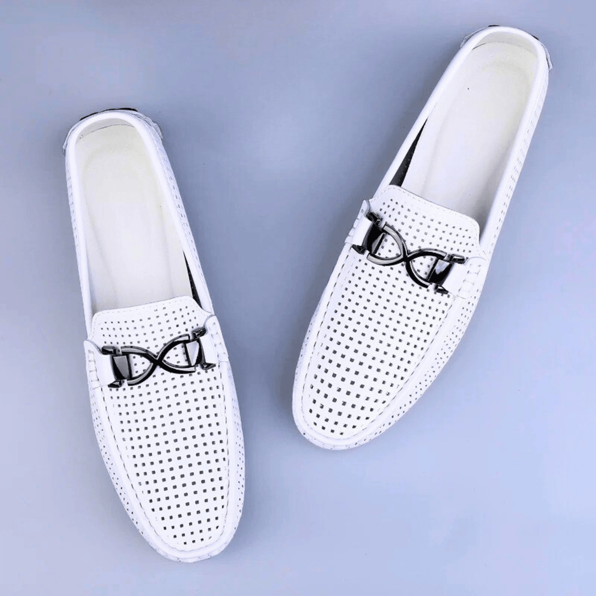 Perforated driving loafer with metal trim and flat treaded sole