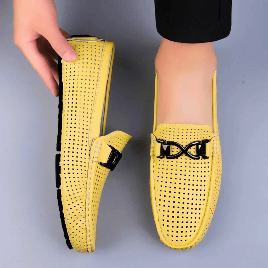 Perforated driving loafer with metal trim and flat treaded sole